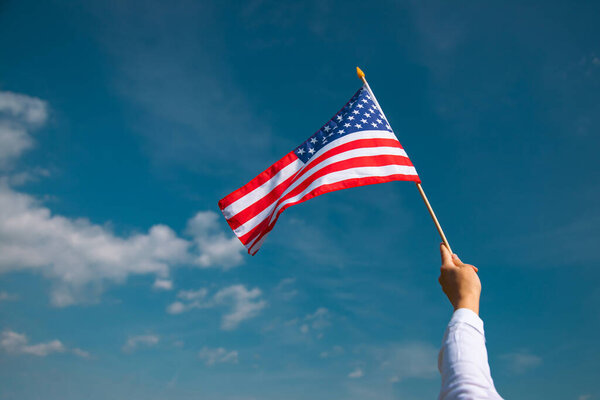 Celebrating Independence Day. United States of America USA flag over blue sky