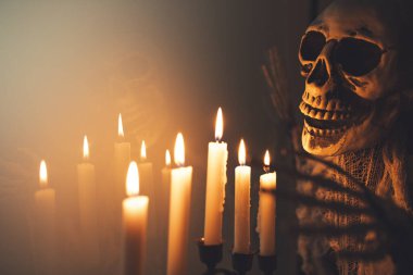 Creepy figure with and candle lights. Halloween festival concept.
