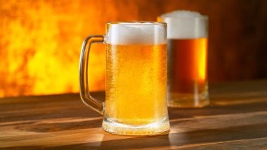 Freshly brewed beer in a pint on old wooden table, close-up