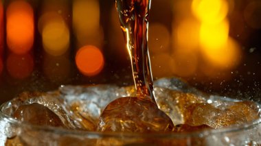 Freeze motion of pouring cola, macro shot