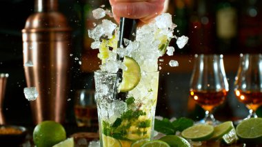 Close-up of preparing mojito cocktail on a bar clipart