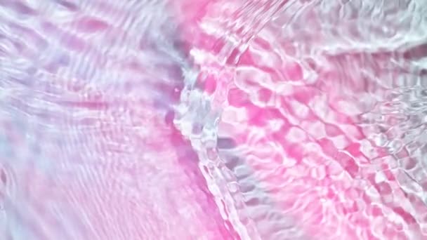 在浅蓝色粉红背景上 水花表面的超慢速运动 在1000 Fps的高速摄影相机上拍摄 — 图库视频影像