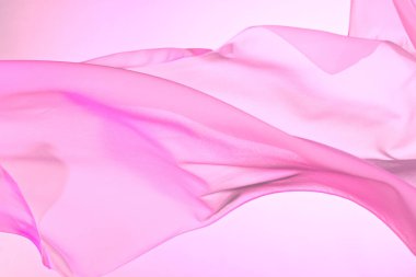 Dalgalanan pembe ipek kumaş, yumuşak dalgalara sarılı renkli kumaş boş yatak örtüsü