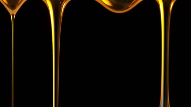 Super Slow Motion Shot Falling Golden Oil Droplets Isolado Fundo — Vídeo de Stock