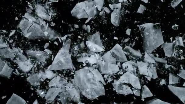 Super Slow Motion Shot Falling Piece Ice Black Stone Background — Stock Video