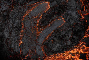 Aerial view of the texture of a solidifying lava field, close-up clipart