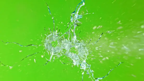 Close Gunshot Glass Shattering Green Background — Stock Photo, Image