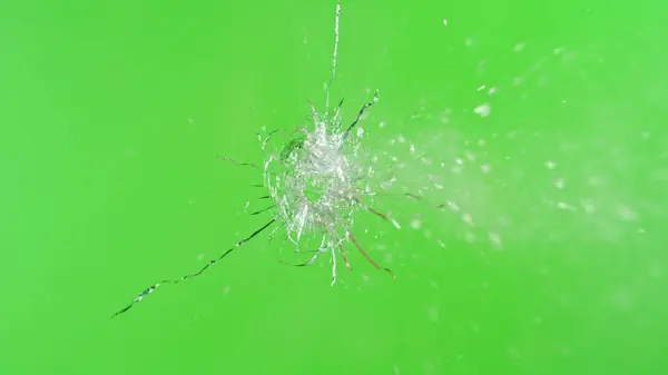 Close Gunshot Glass Shattering Green Background — Stock Photo, Image