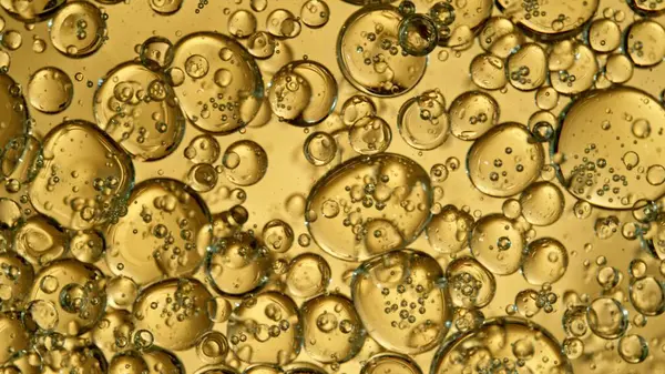 Freeze Motion Shot Moving Oil Bubbles Golden Background Stock Photo