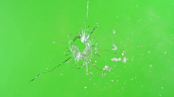 Close Gunshot Glass Shattering Green Background Stock Image