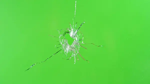 Close Gunshot Glass Shattering Green Background Stock Picture