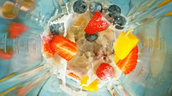 Freeze Motion Mixing Pieces Berries Blender Milk Top Shot Royalty Free Stock Images