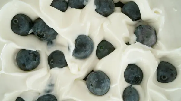 Fresh Blueberries Falling Yoghurt Cream Top View — Stock Photo, Image