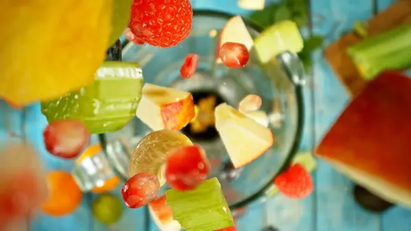 Freeze Motion Mixing Pieces Fruit Vegetables Blender Top Shot Stock Photo