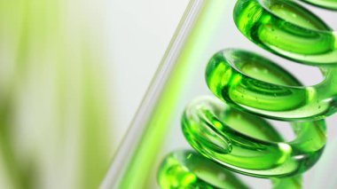 Doğal madde ve çiçeklerden doğal yağ elde etmek. Yeşil yağ spiral şeklinde akar. Süper yavaş çekim 1000 FPS 'de yüksek hızlı sinematik kamerayla çekildi.