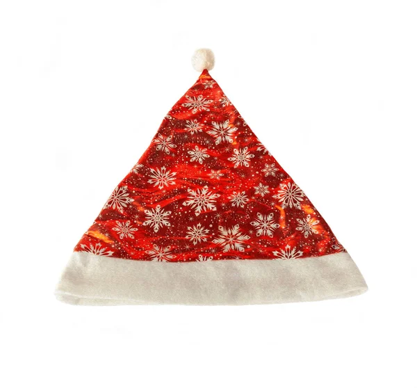 白い背景に隔離された雪の結晶パターンを持つサンタクロースやクリスマスの赤い帽子 — ストック写真