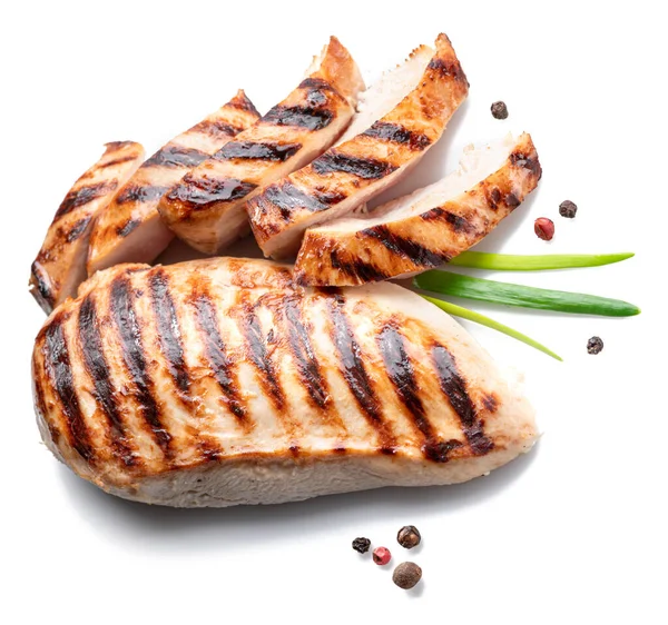 Grilled chicken fillet with herbs isolated on white background.