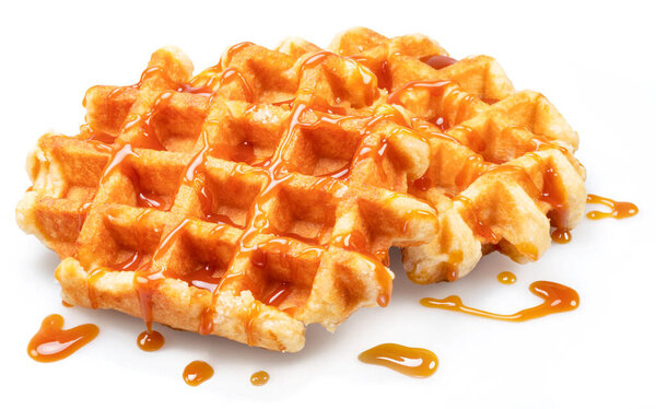 Belgian waffle with caramel topping isolated on white background.