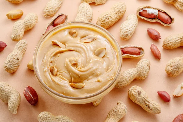 Bowl Peanut Butter Peanuts Beige Background Top View — Stock Photo, Image