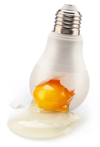 Egg Yolk Leaking Light Bulb Crack Conceptual Picture — Stockfoto
