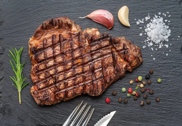 Grilled Delicious Ribeye Steak Some Seasonings Black Slate Serving Plate — Stock Photo, Image