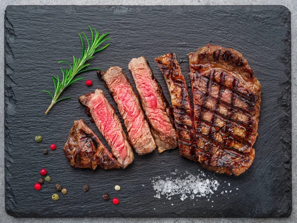 Grilled Delicious Ribeye Steak Slices Some Seasonings Black Slate Serving — Photo