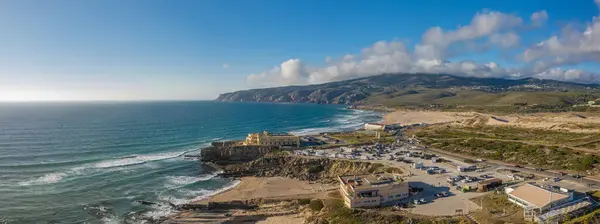 Rocky  and sandy coastlines of Portugal ocean coast. Aerial view of Guincho beach.