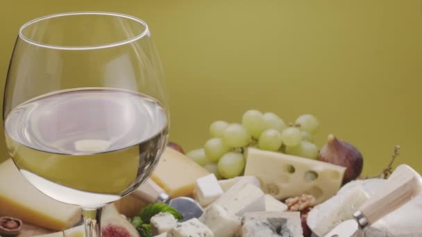 Glass White Wine Variety Sliced Cheeses Fruits Mint Nuts Cheese — Stock Video