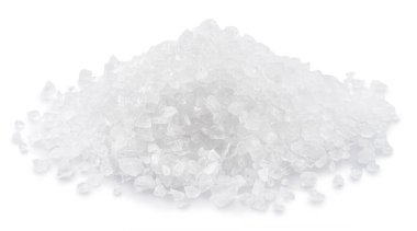 Pile of salt crystals on white background. File contains clipping path.