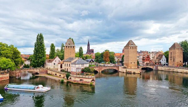 Panoramic view on The Ponts Couverts in Strasbourg with blue cloudy sky. France. 