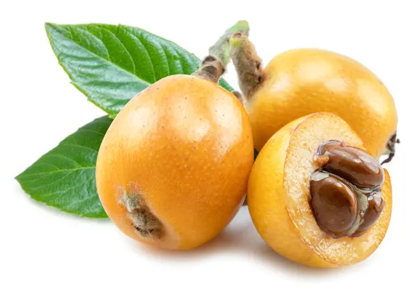 stock image Ripe perfect loquats fruits with green leaves isolated on white background.