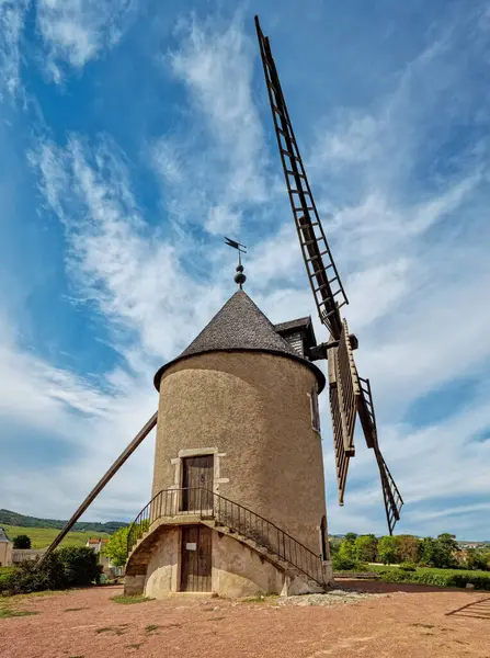 stock image The eponymous windmill of famous french red wine situated near Romanche -Thorins. 