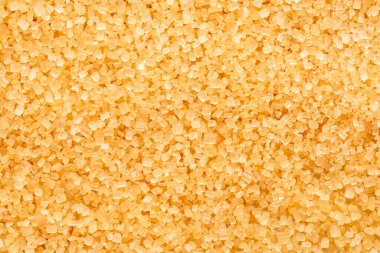 Kahverengi şeker kristalleri yakınlaşıyor. Gıda arkaplanı.