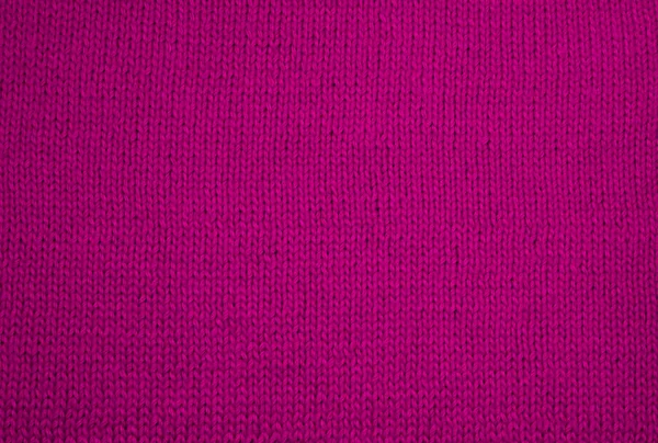 Pink knitted fabric background texture