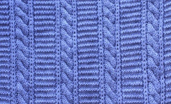 knitting braids, sweater fabric background texture