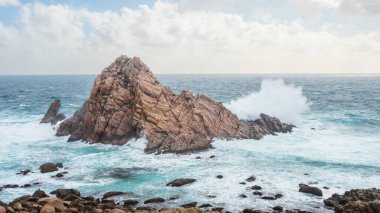 Sugarloaf Rock, a famous coastal landmark near the town of Dunsborough in South-West Australia. The rock is the world's most southerly nesting site for the Red-Tailed Tropic Bird. clipart