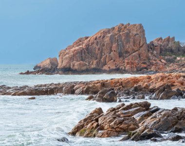 Castle Rock, near Dunsborough in Western Australia, is a massive chunk of orange granite standing tall at the end of beautiful Castle Bay. clipart