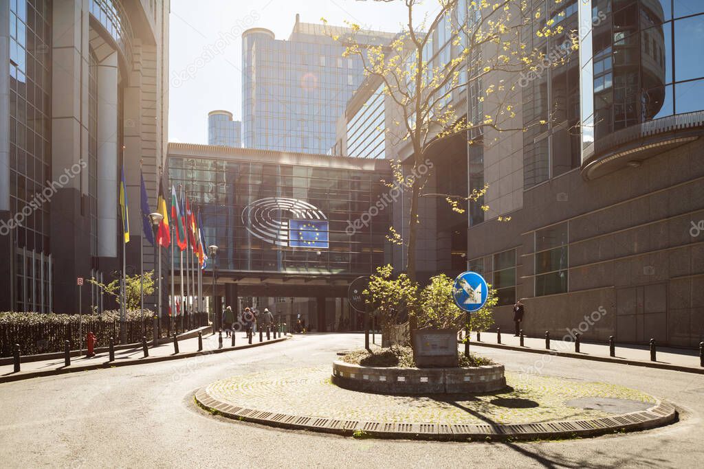 Brussels, Belgium - April 10, 2024: The European Parliament building with a green park and modern details of the architecture of the city of Brussels.