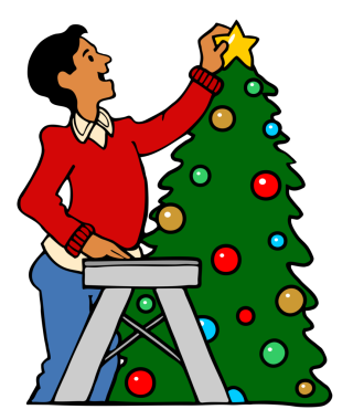 Adam Noel ağacının tepesine yıldız ekliyor.