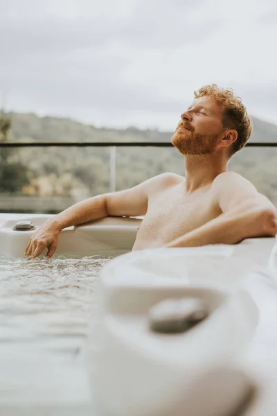 Attractive Young Man Enjoying Outdoor Hot Tub Vacation — Foto Stock