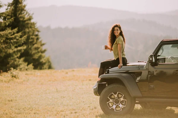 Pretty Young Woman Relaxing Terrain Vehicle Hood Countryside — Fotografia de Stock