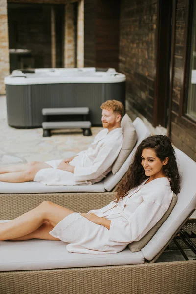 Handsome Young Couple Relaxing Beds Outdoor Terrace — Stockfoto