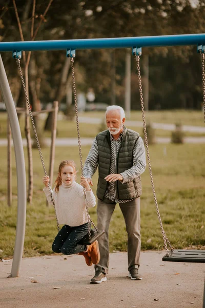 Handsome Grandfather Spending Time His Granddaughter Park Playground Autumn Day — Stock Photo, Image