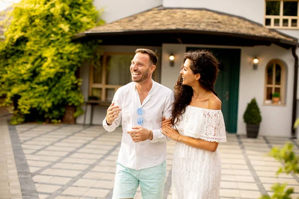 stock image Handsome young couple walking in the backyard