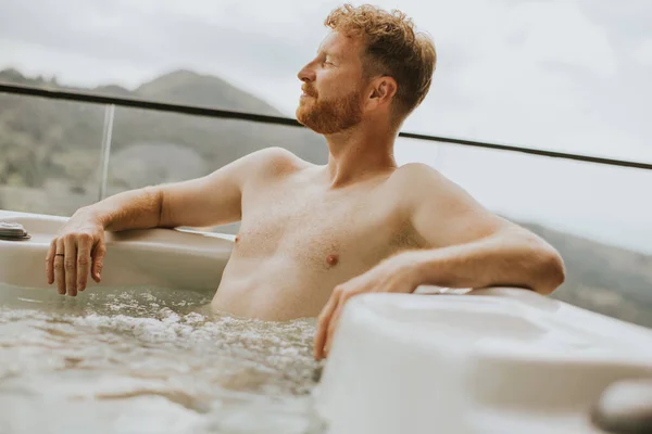 Attractive Young Man Enjoying Outdoor Hot Tub Vacation — Fotografia de Stock