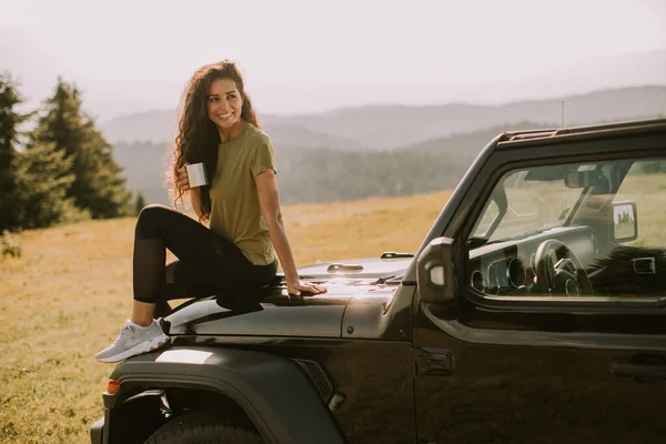 Pretty Young Woman Relaxing Terrain Vehicle Hood Countryside — Stock Fotó