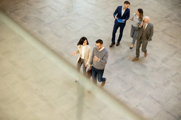 Group Young Senior Business People Walking Office Hallway Captured Aerial Stock Image