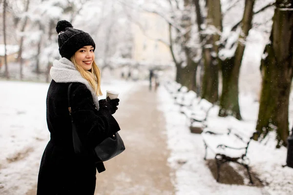 Young Woman Stands Winter Wonderland Wearing Warm Clothing Drinking Hot —  Fotos de Stock
