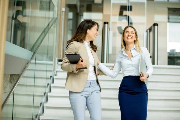 Two Cute Young Business Women Walking Stairs Office Hallway — Stock Photo, Image