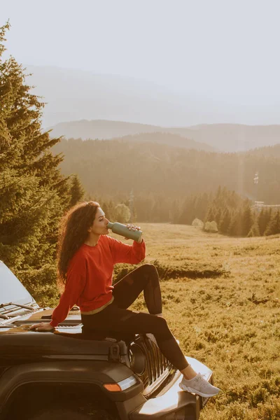 Pretty Young Woman Relaxing Terrain Vehicle Hood Countryside — Stock fotografie